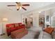 Spacious living room with ceiling fan, plush seating, and open floor plan at 607 Marcus St # 27, Venice, FL 34285