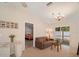 Bright living room with vaulted ceiling, access to the bedroom, and sliding glass doors at 607 Marcus St # 27, Venice, FL 34285