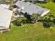 Property view showcasing backyard patio and landscaping at 698 Harrington Lake S Dr # 9, Venice, FL 34293