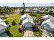 Aerial view showcasing a charming house and the surrounding neighborhood at 698 Harrington Lake S Dr # 9, Venice, FL 34293