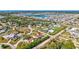 An aerial view of a house in a residential neighborhood near the water at 702 2Nd Nw Ave, Ruskin, FL 33570