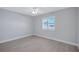 Spacious bedroom featuring wood-look floors and window with shutters at 702 2Nd Nw Ave, Ruskin, FL 33570