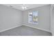 Simple bedroom with light grey walls and wood-look flooring at 702 2Nd Nw Ave, Ruskin, FL 33570