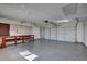 Spacious garage with epoxy flooring and ample storage at 702 2Nd Nw Ave, Ruskin, FL 33570