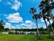 Serene lakefront view with lush greenery at 7107 Heron Ct, Sarasota, FL 34243