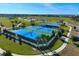 Aerial view of two tennis courts and one pickleball court at 8290 Velda Trl, Sarasota, FL 34241