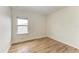 Bright bedroom featuring hardwood floors and large window at 865 Molly Cir, Sarasota, FL 34232