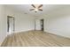 Well lit bedroom with hardwood floors and access to bathroom at 865 Molly Cir, Sarasota, FL 34232