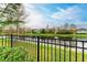 Waterfront view from backyard with fence at 865 Molly Cir, Sarasota, FL 34232