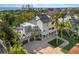 Luxury beachfront home with expansive driveway and ocean views at 8855 Midnight Pass Rd, Sarasota, FL 34242