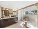 Modern bathroom with double vanity, glass shower, and tile flooring at 8855 Midnight Pass Rd, Sarasota, FL 34242