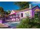 Pink building with purple accents and outdoor seating at 8855 Midnight Pass Rd, Sarasota, FL 34242