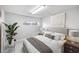 Bright and airy bedroom with a comfortable queen-size bed, and stylish nightstands at 8855 Midnight Pass Rd, Sarasota, FL 34242