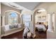 Bedroom with a window seat, hardwood floors, and a view of another bedroom at 8855 Midnight Pass Rd, Sarasota, FL 34242