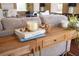 Wooden console table with books, candle, and decor at 8855 Midnight Pass Rd, Sarasota, FL 34242