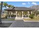 Large covered patio with a built-in bar and plenty of space for entertaining at 8855 Midnight Pass Rd, Sarasota, FL 34242