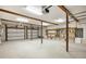 Two-car garage with additional storage space and white garage doors at 8855 Midnight Pass Rd, Sarasota, FL 34242