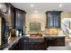 Kitchen with dark wood cabinets, copper sink, and a view from the window at 8855 Midnight Pass Rd, Sarasota, FL 34242