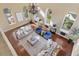 Living area with two sofas, armchairs, coffee table, rug and hardwood flooring at 8855 Midnight Pass Rd, Sarasota, FL 34242