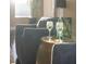 Close-up of a stylish side table with drinks in a cozy living room at 8855 Midnight Pass Rd, Sarasota, FL 34242