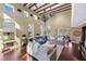 Spacious living room with high ceilings, wood beams, and ample natural light at 8855 Midnight Pass Rd, Sarasota, FL 34242