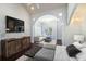 Spacious main bedroom with sitting area, wood floors, and access to balcony at 8855 Midnight Pass Rd, Sarasota, FL 34242