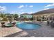 Inviting backyard oasis featuring a sparkling pool, spa, and covered patio area at 8855 Midnight Pass Rd, Sarasota, FL 34242