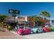 Beachfront rental shop with colorful carts and bicycles at 8855 Midnight Pass Rd, Sarasota, FL 34242
