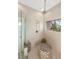 Spacious, modern shower with built-in seating and multiple shower heads at 8855 Midnight Pass Rd, Sarasota, FL 34242