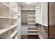 Large walk-in closet with ample shelving and hanging space at 8855 Midnight Pass Rd, Sarasota, FL 34242