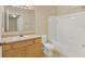 Bathroom featuring a white bathtub, toilet, and vanity with light oak cabinets at 1130 Villagio Cir # 203, Sarasota, FL 34237