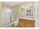 Bathroom with a glass shower, vanity sink, and tile flooring at 1130 Villagio Cir # 203, Sarasota, FL 34237