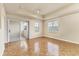 Spacious bedroom with wood parquet floors, sliding glass door to balcony, and ample natural light at 1130 Villagio Cir # 203, Sarasota, FL 34237