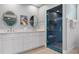 Elegant bathroom with double vanity, large shower, and decorative mirrors at 116 50Th St, Holmes Beach, FL 34217
