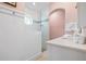 Charming bathroom with white beadboard and a walk-in shower at 116 50Th St, Holmes Beach, FL 34217