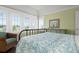 Bedroom with a bed and window seat at 116 50Th St, Holmes Beach, FL 34217