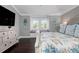 Main bedroom with a large bed, window seat, and a dresser at 116 50Th St, Holmes Beach, FL 34217