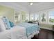 Light green bedroom with a bed and window seat at 116 50Th St, Holmes Beach, FL 34217