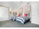 Charming bedroom with twin beds, nautical decor, and window at 116 50Th St, Holmes Beach, FL 34217