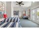 Nautical-themed bedroom with twin beds and access to balcony at 116 50Th St, Holmes Beach, FL 34217