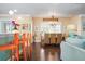 Dining room features round wooden table and wicker chairs at 116 50Th St, Holmes Beach, FL 34217