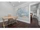 Home office with large map accent wall and hardwood floors at 116 50Th St, Holmes Beach, FL 34217