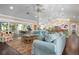 Open living area with hardwood floors, and view into the kitchen at 116 50Th St, Holmes Beach, FL 34217