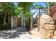 Private outdoor shower with wood and stone accents at 116 50Th St, Holmes Beach, FL 34217