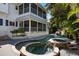 Resort-style pool and spa with waterfall feature at 116 50Th St, Holmes Beach, FL 34217