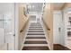 Stunning wooden staircase leading to upper level at 116 50Th St, Holmes Beach, FL 34217