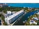 Aerial view of waterfront community with modern building and boat slips at 1709 N Tamiami Trl # A421, Sarasota, FL 34234