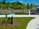 Sign indicating dog walk path for residents and guests at 1709 N Tamiami Trl # A421, Sarasota, FL 34234