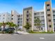 Modern building exterior with palm trees and ample parking at 1709 N Tamiami Trl # A421, Sarasota, FL 34234