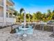 Outdoor grilling area with table and chairs near building at 1709 N Tamiami Trl # A421, Sarasota, FL 34234